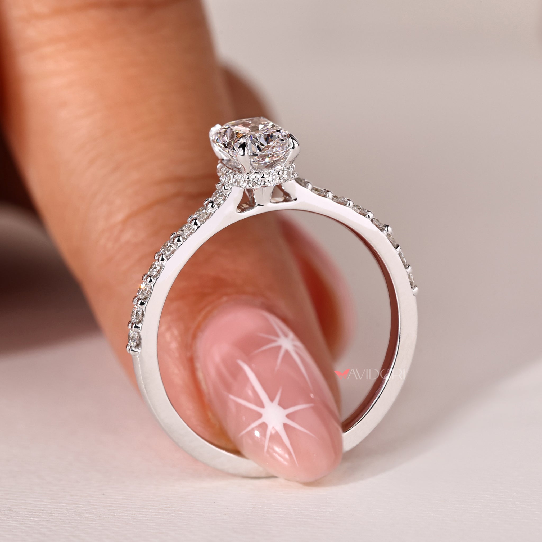 White gold ring featuring a dazzling cushion cut diamond