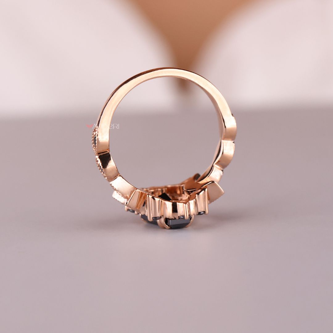 Rose gold ring featuring a coffin design with black moissanite stone.