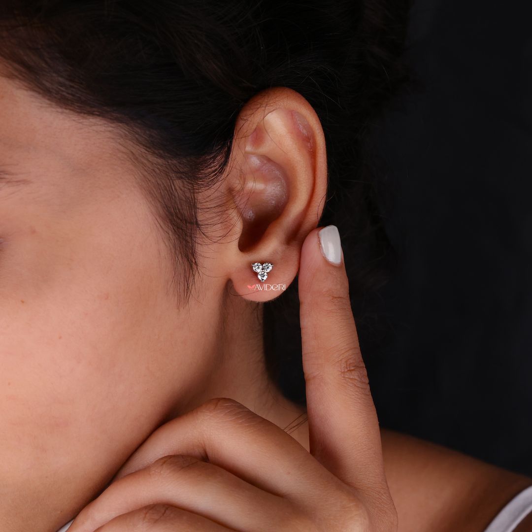 Moissanite earrings with three stone design for an elegant and modern touch.