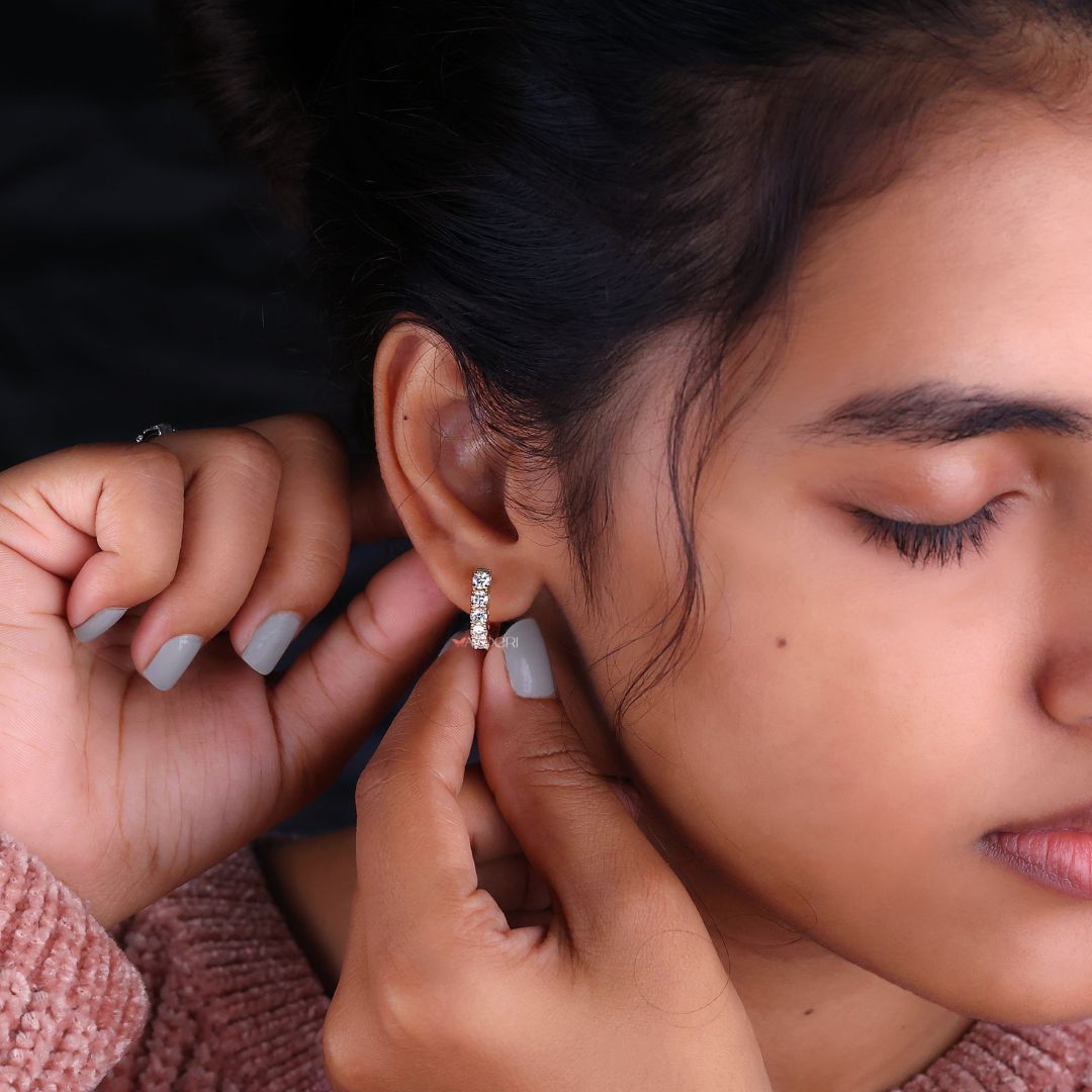 IGI certified earrings with round diamond details