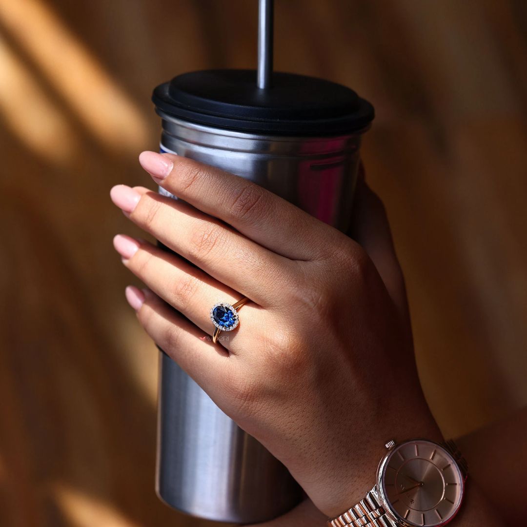 The oval halo engagement ring shines with layered brilliance and modern sophistication.
