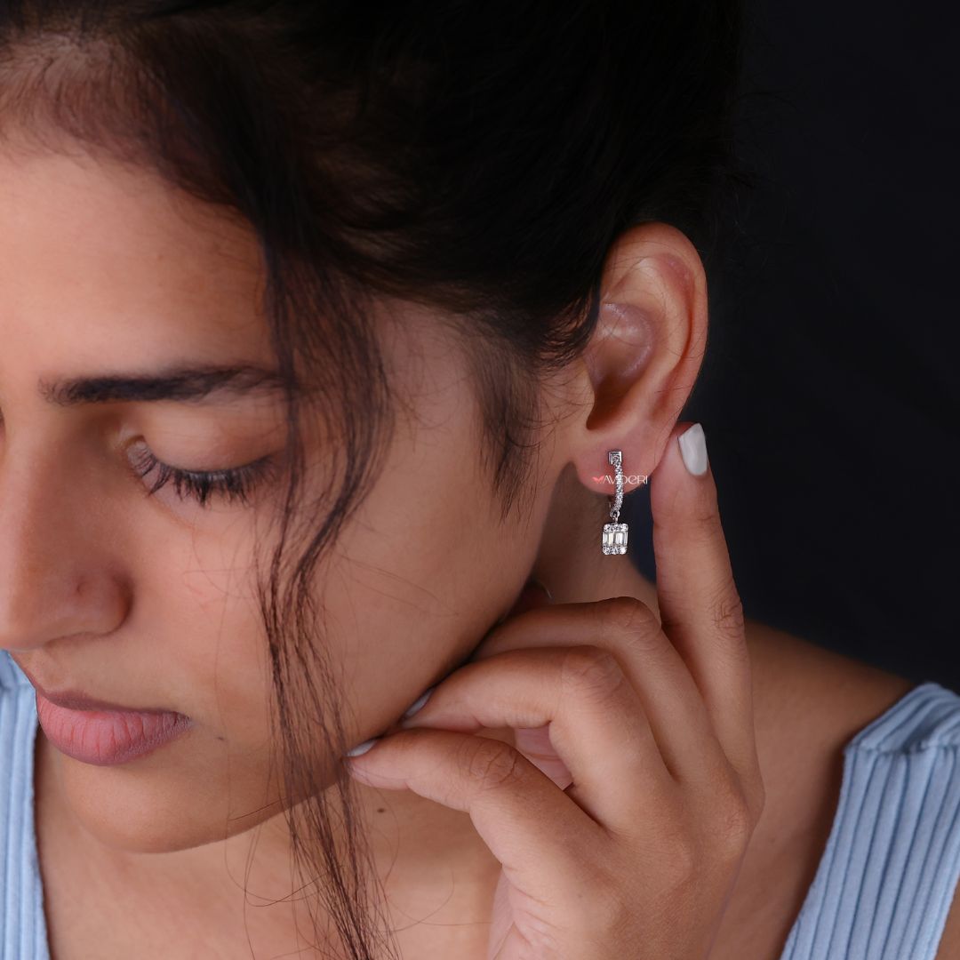 Round side stone earrings with baguette cut Moissanite for a chic appeal.