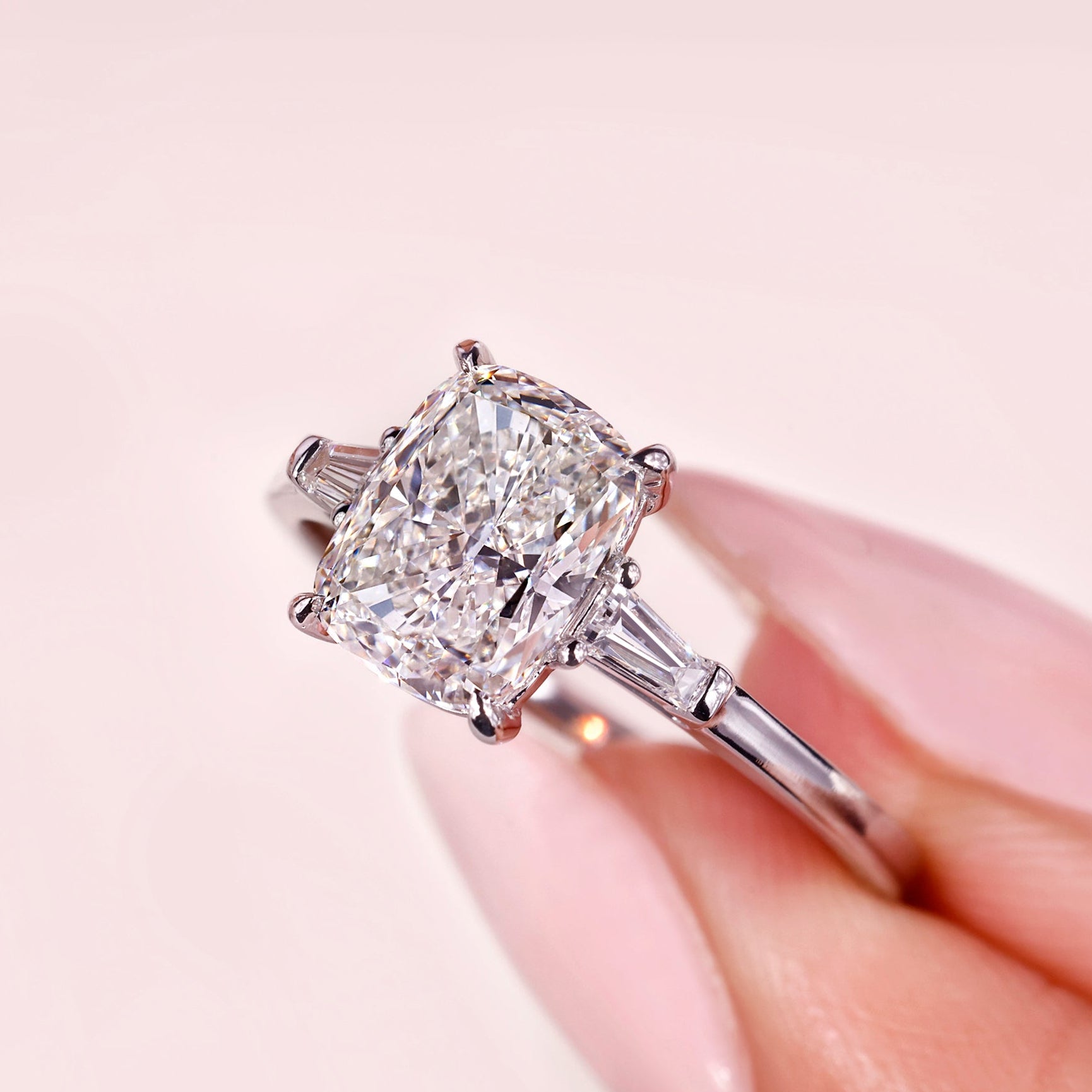 3 stone engagement ring with cushion cut engagement ring.