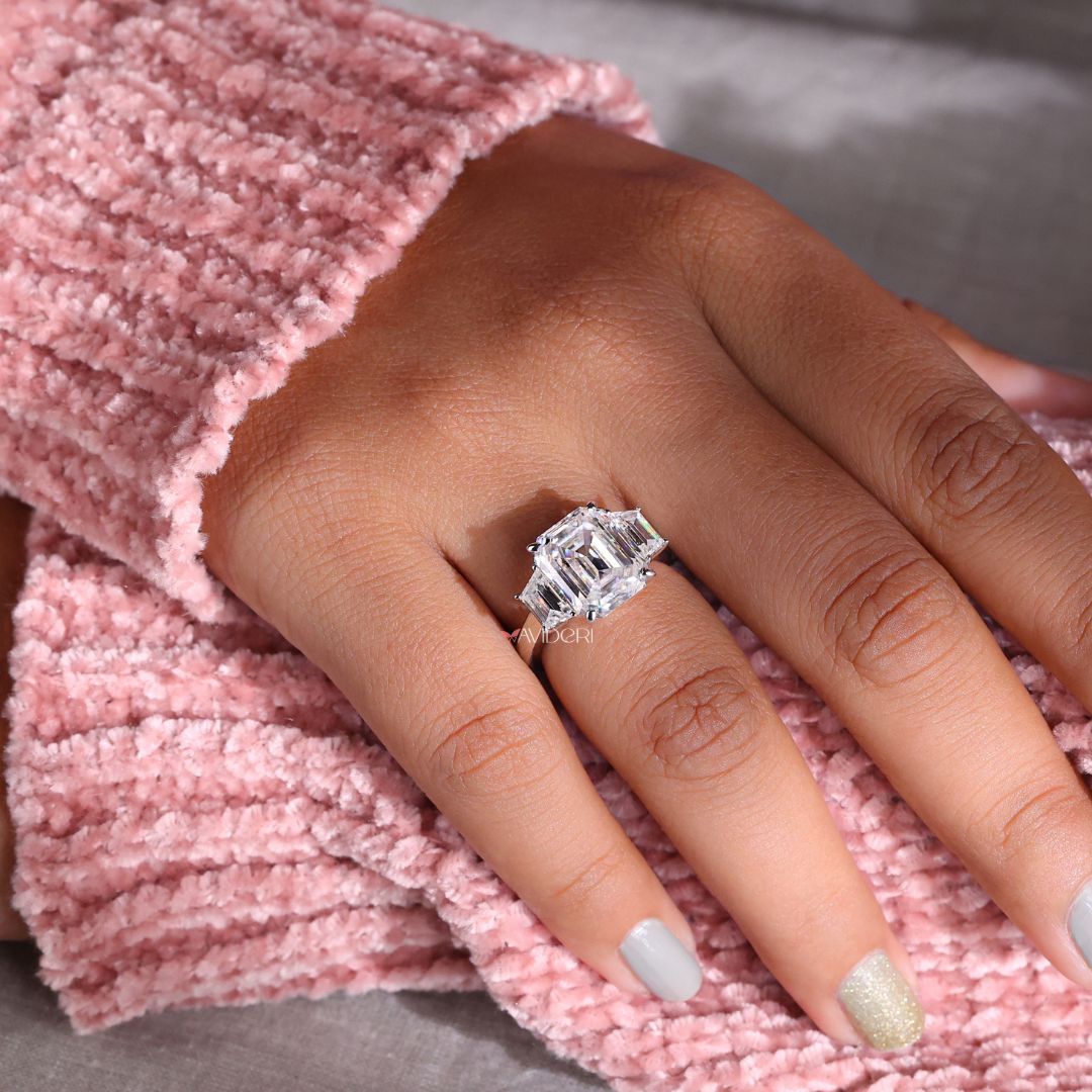 Emerald cut 3 stone ring with a classic and elegant design.