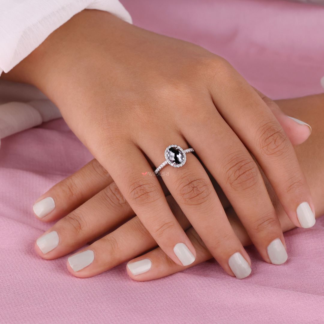 Round engagement ring with a beautiful oval moissanite stone for elegance.