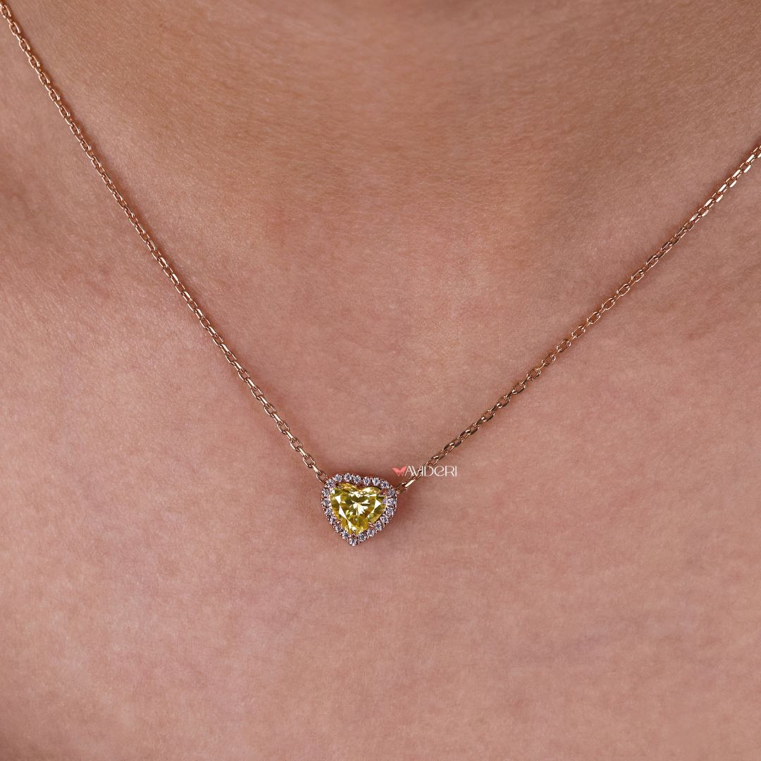 Customizable heart pendant with a moissanite halo setting.