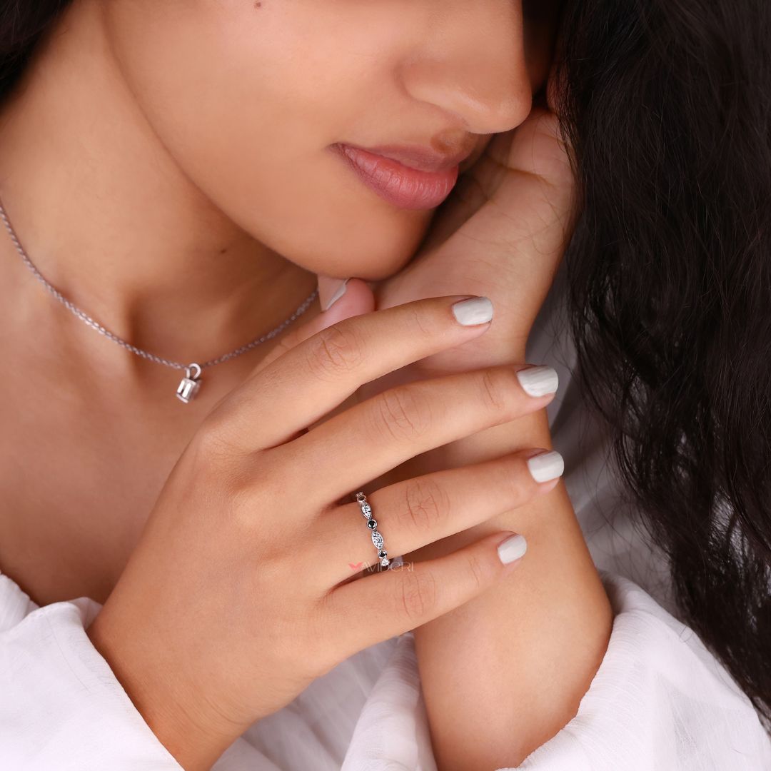 Half eternity band offers balanced sparkle with stones set halfway around the band.