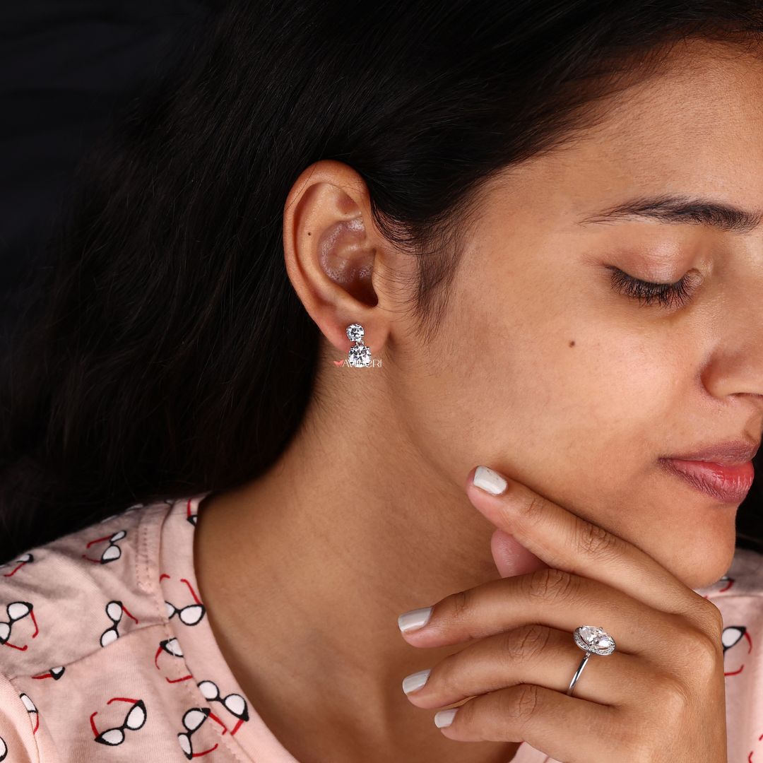 Earrings with round cut Moissanite for a sparkling, elegant look.