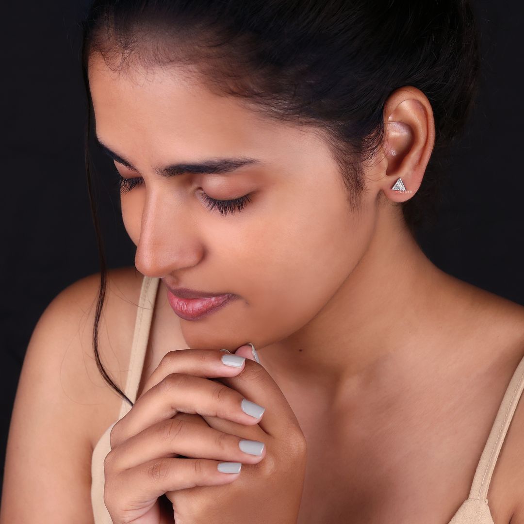 Round cut earrings set in triangle stud earrings style with a modern touch.