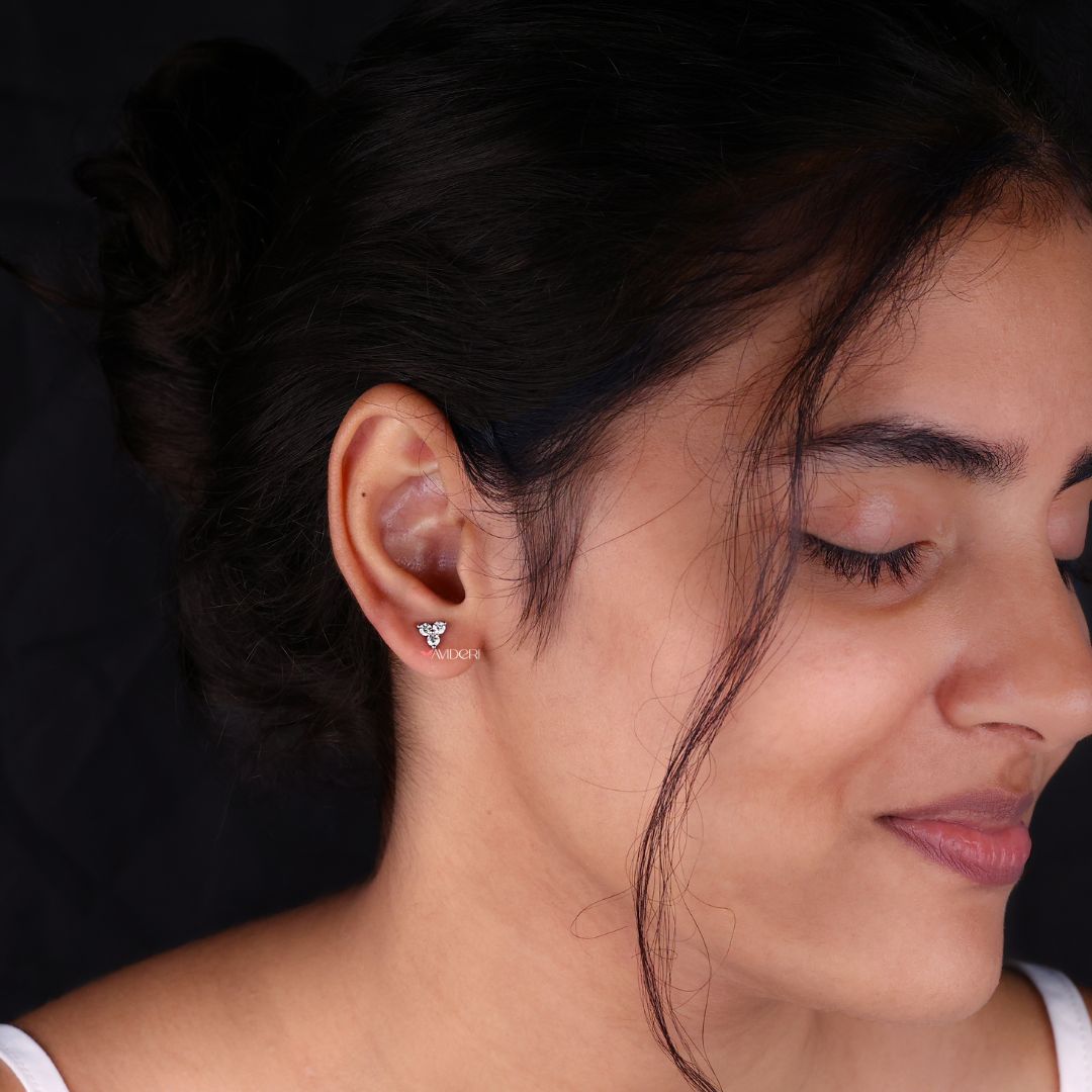 Moissanite stud earrings with three stone design for a unique and chic style.