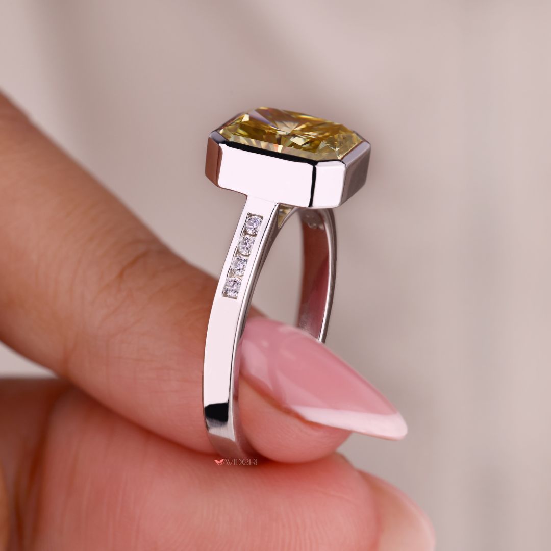 White gold and diamond ring with a bezel setting