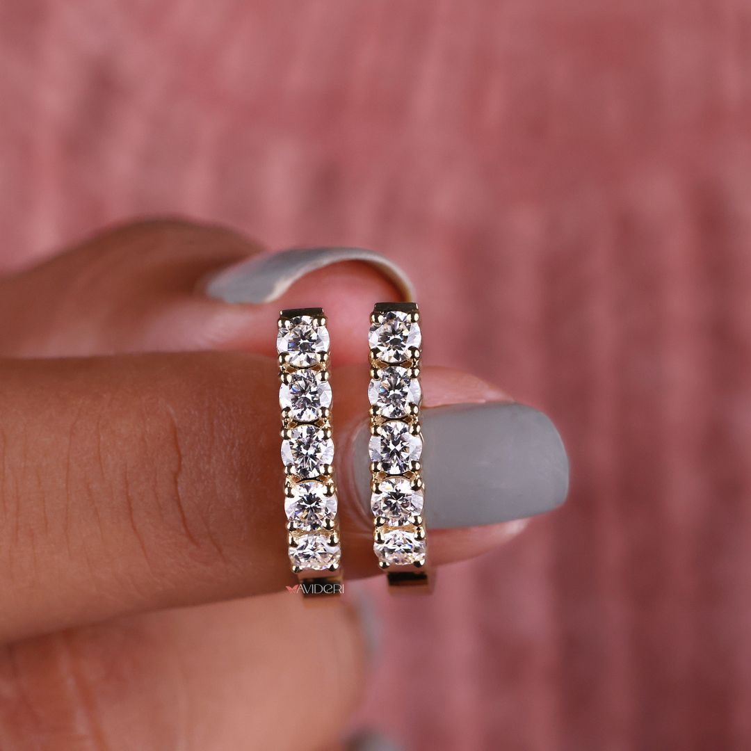 Round stone earrings in a polished gold setting