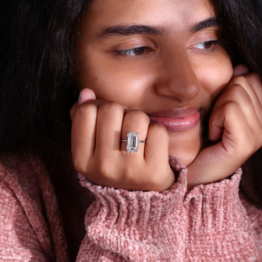 Solitaire moissanite ring with a stunning emerald cut stone.