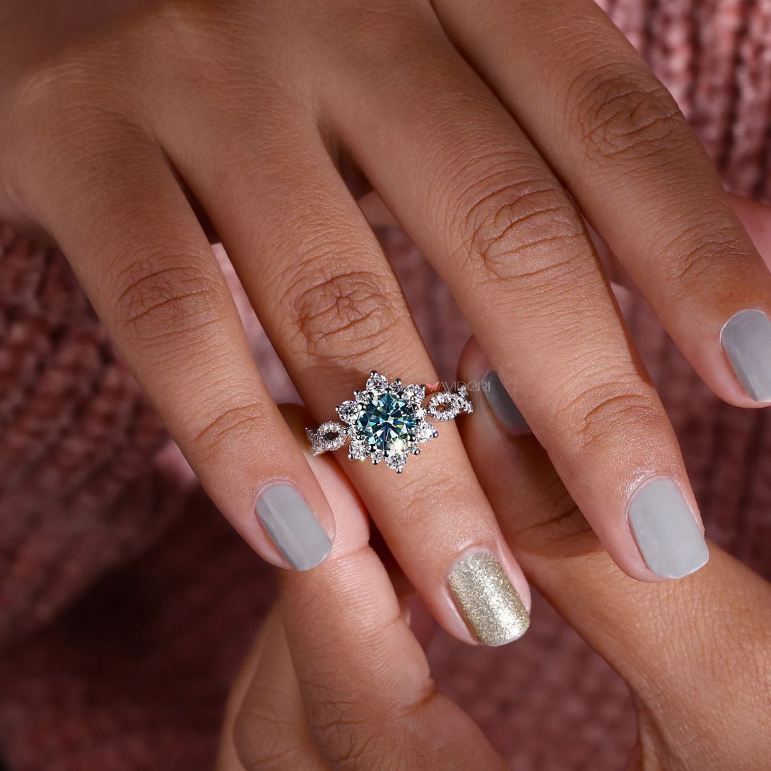 Halo engagement ring with a round cut engagement ring and pave band ring.