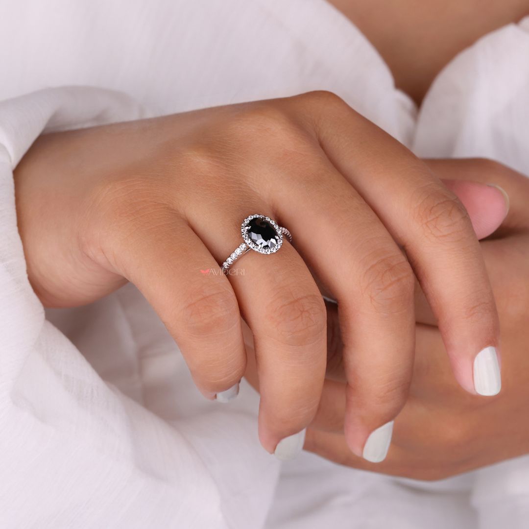 Halo engagement ring with an oval moissanite stone for timeless beauty.