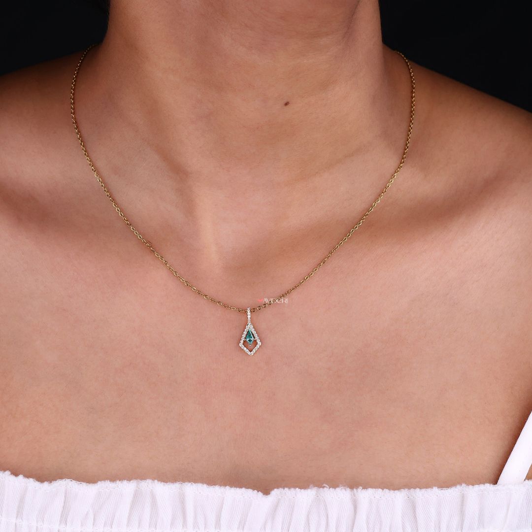 Kite cut pendant with sparkling halo design.