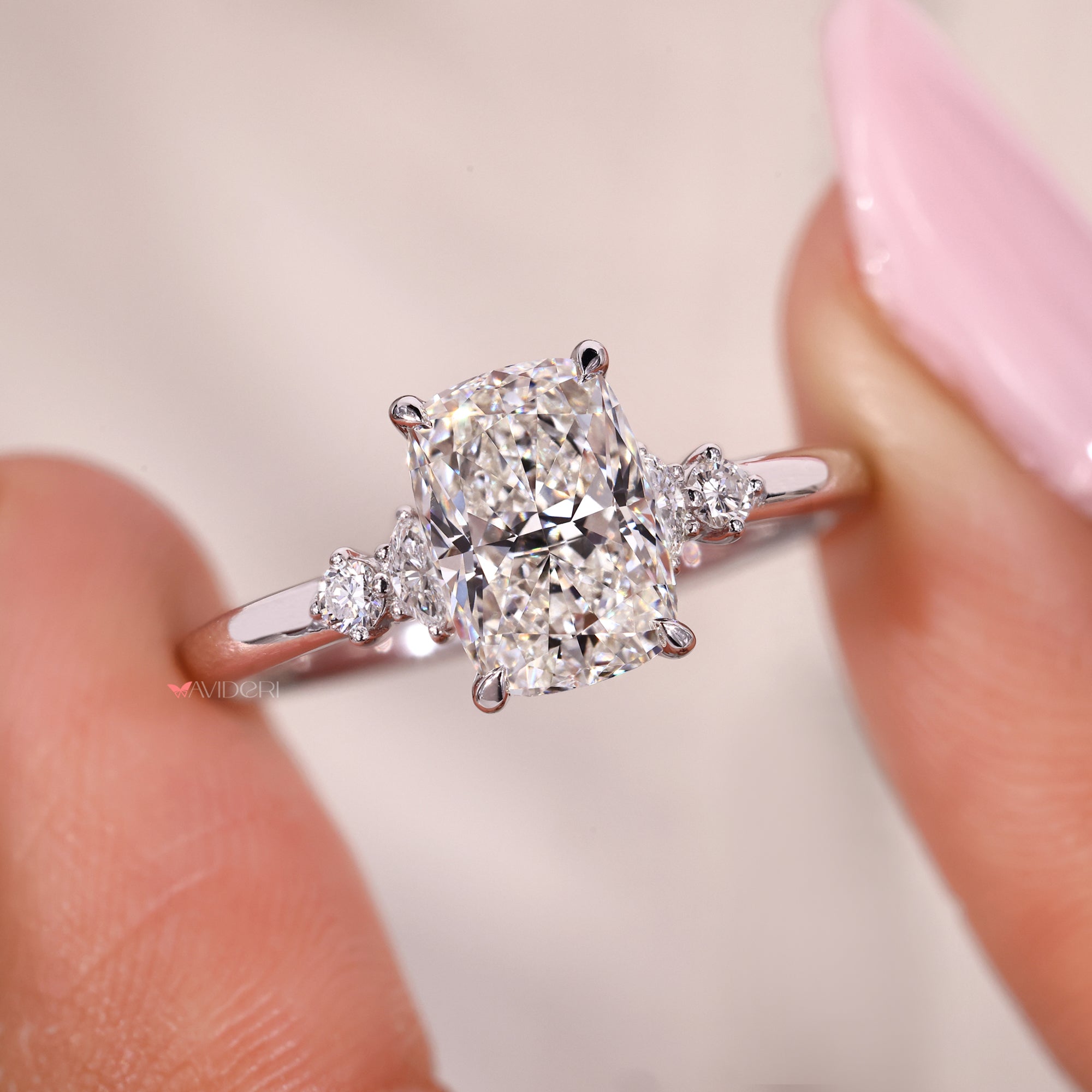 4 claw prong setting in cushion cut diamond ring.