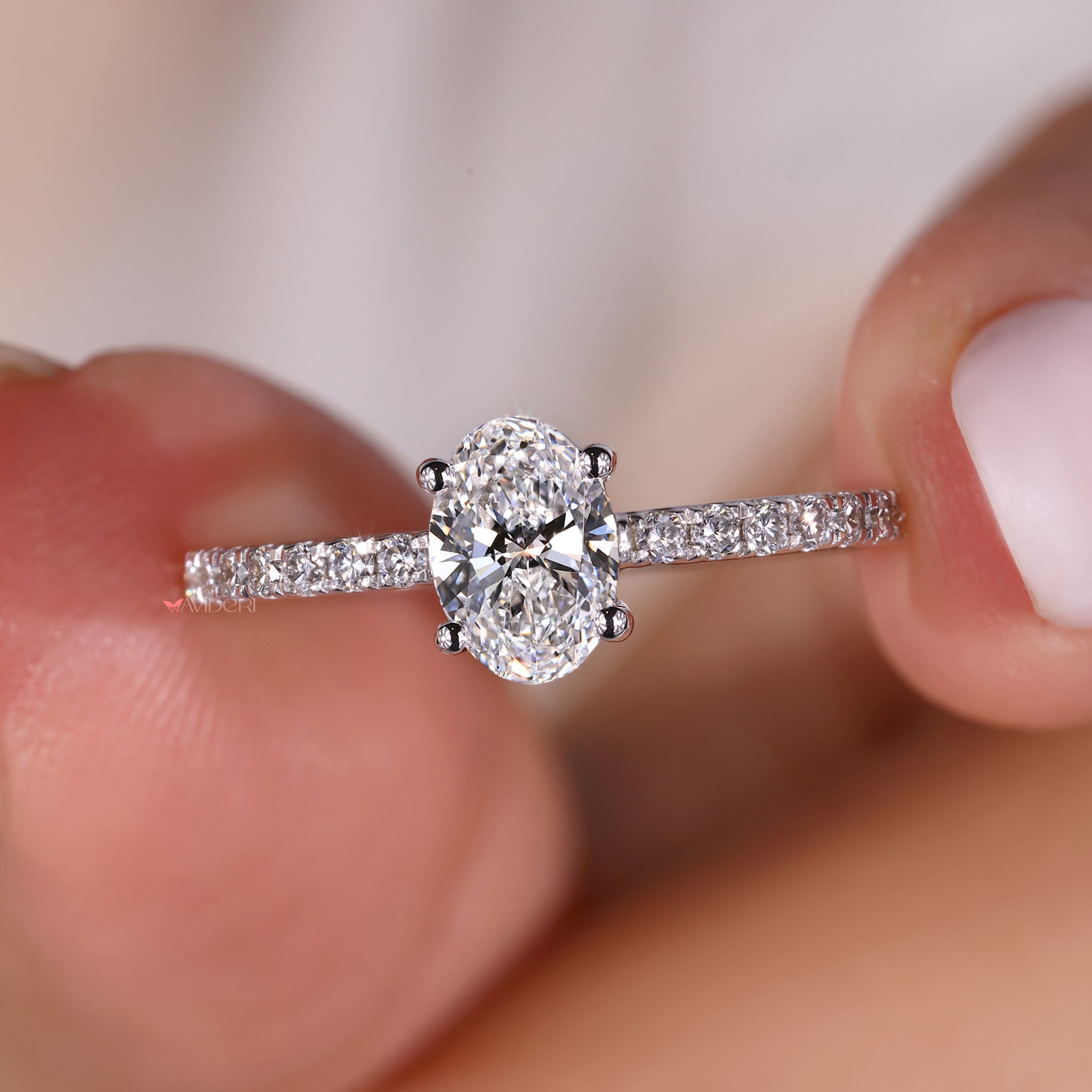 4 prong claw setting with an oval shaped engagement ring for added security.