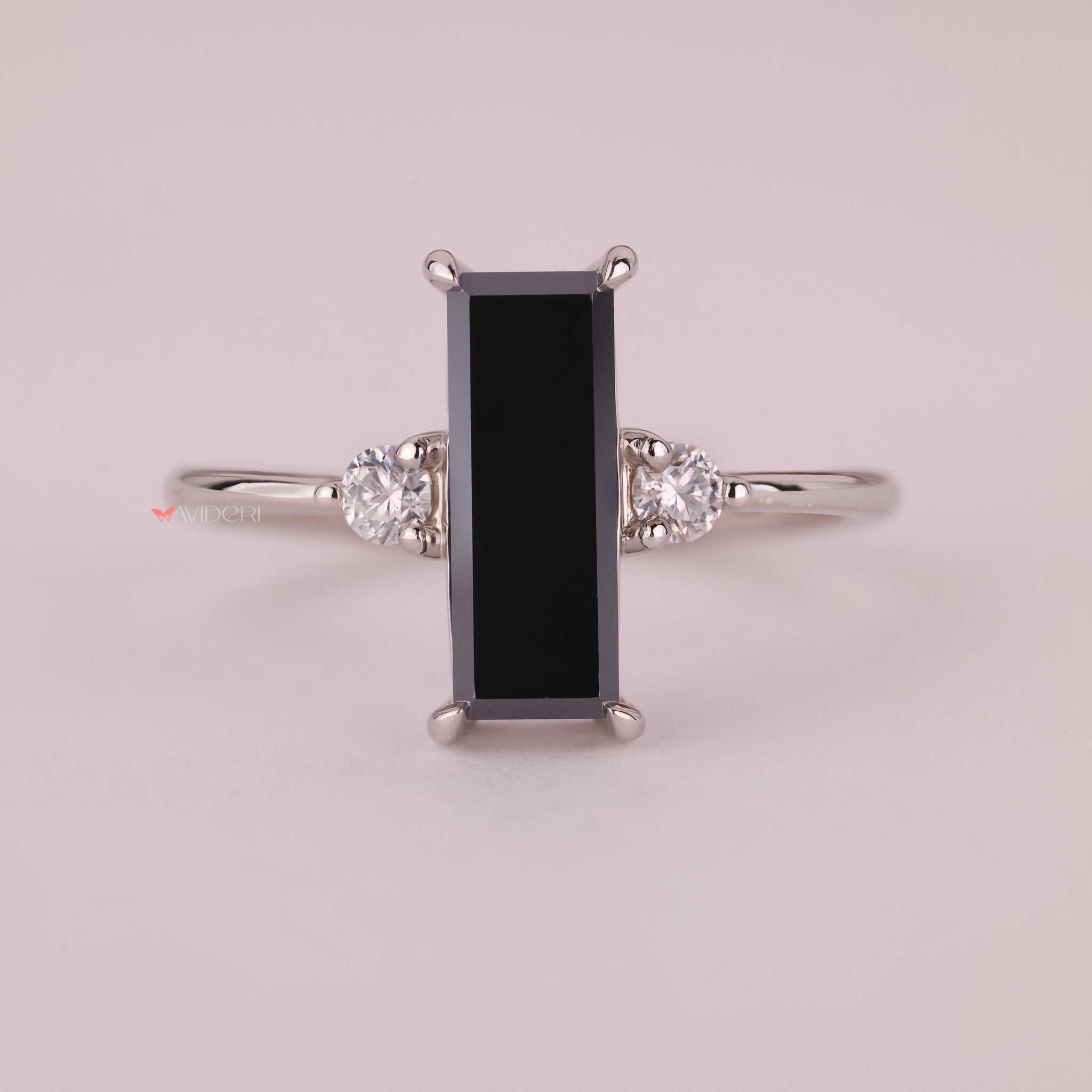 Prong setting ring with three beautiful baguette cut gems