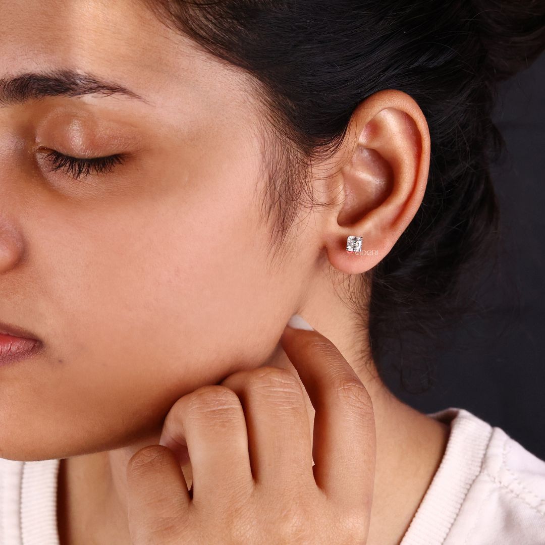 Antique Asscher cut earrings add a vintage-inspired touch.