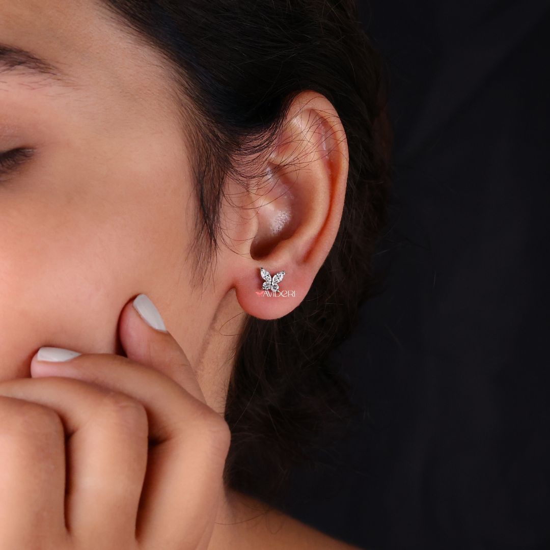 Earrings with Marquise cut Moissanite in a beautiful butterfly stud setting.