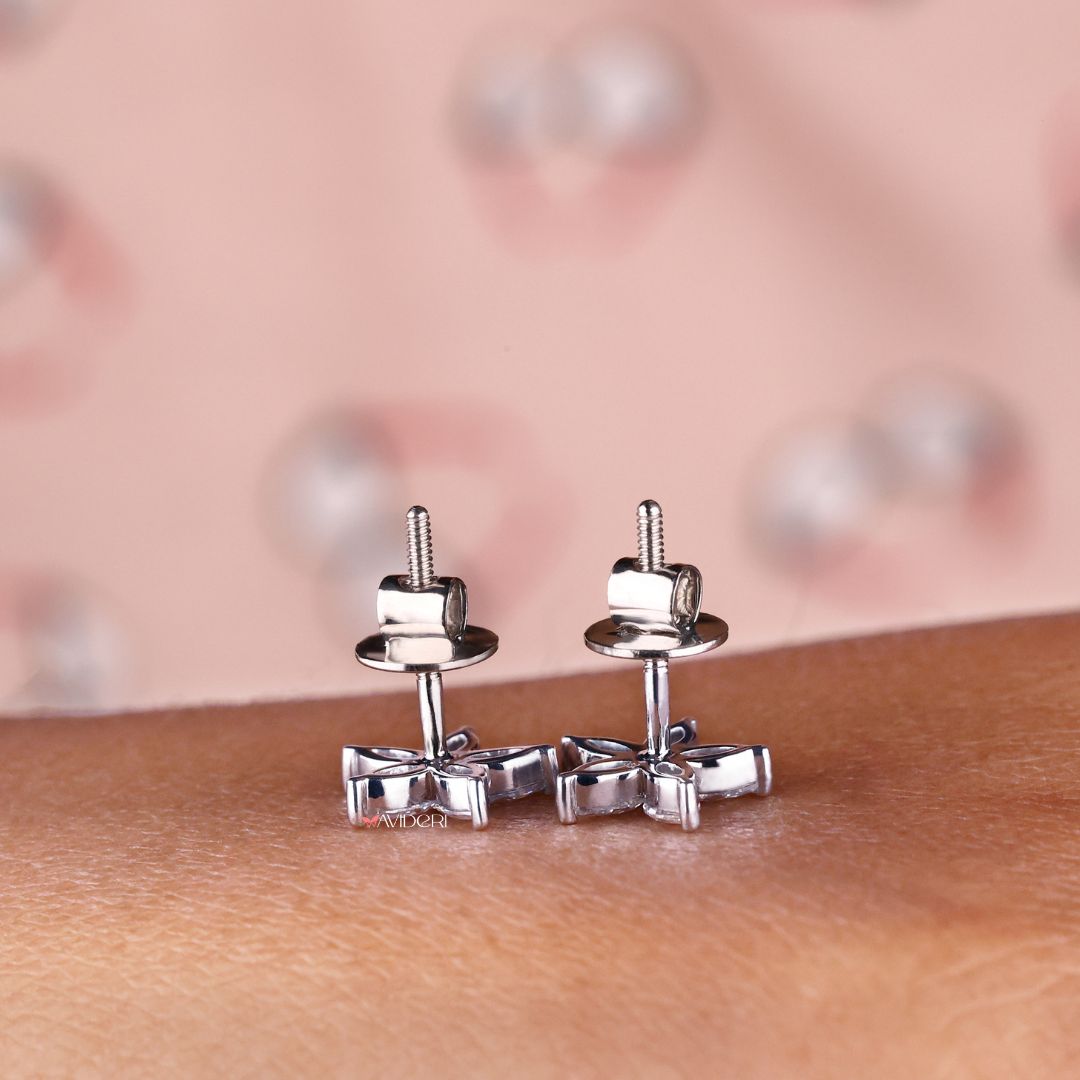 White gold earrings with prong settings and Marquise Moissanite for added sparkle.