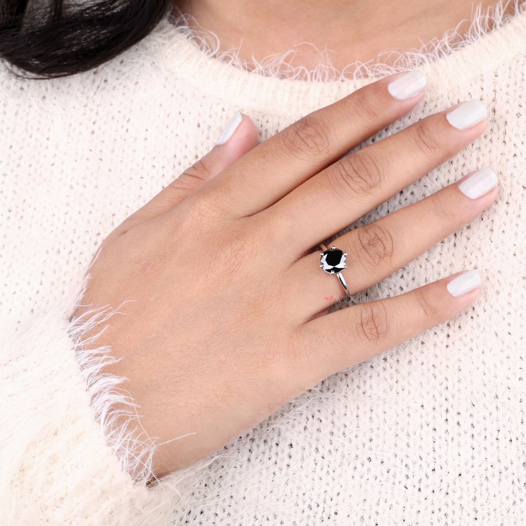 6 prong ring securely holding a brilliant centre stone.