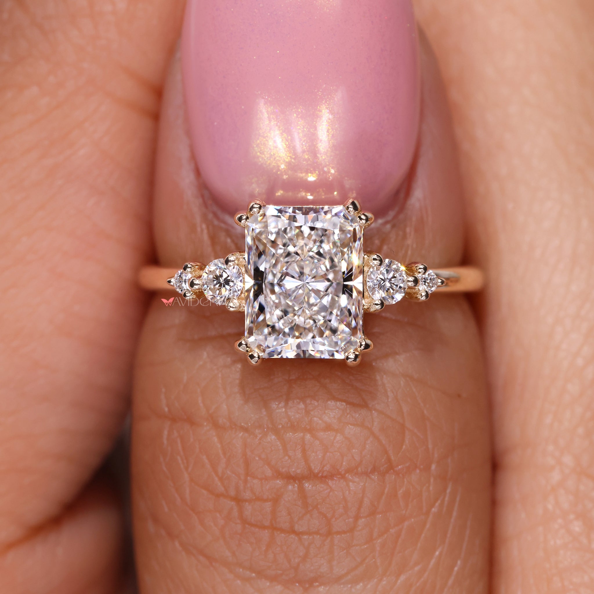 Round diamond ring set with a radiant cut diamond for timeless beauty.