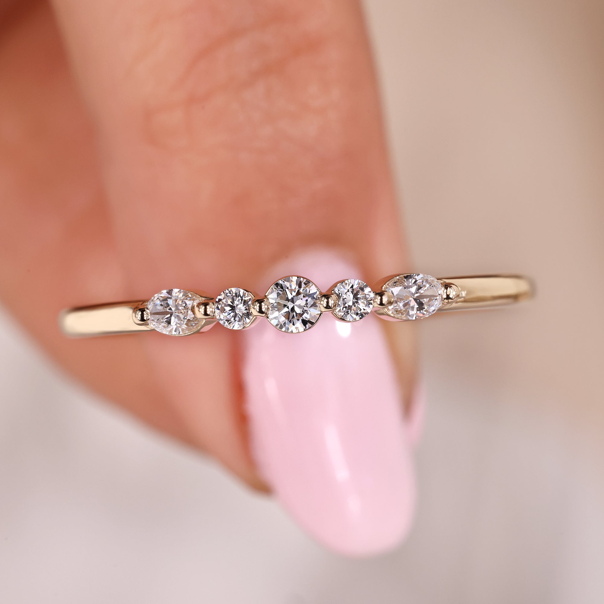 5 stone wedding band with shared prong wedding band.