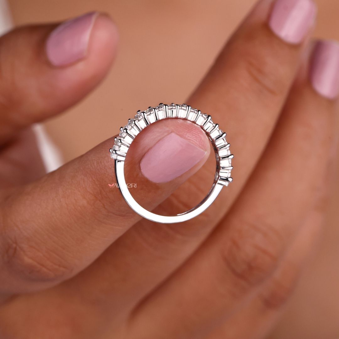 White gold wedding band shines with a polished finish, providing a refined and timeless look.