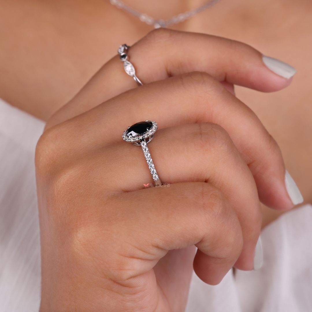 Pave engagement ring with an oval moissanite center for an elegant touch.