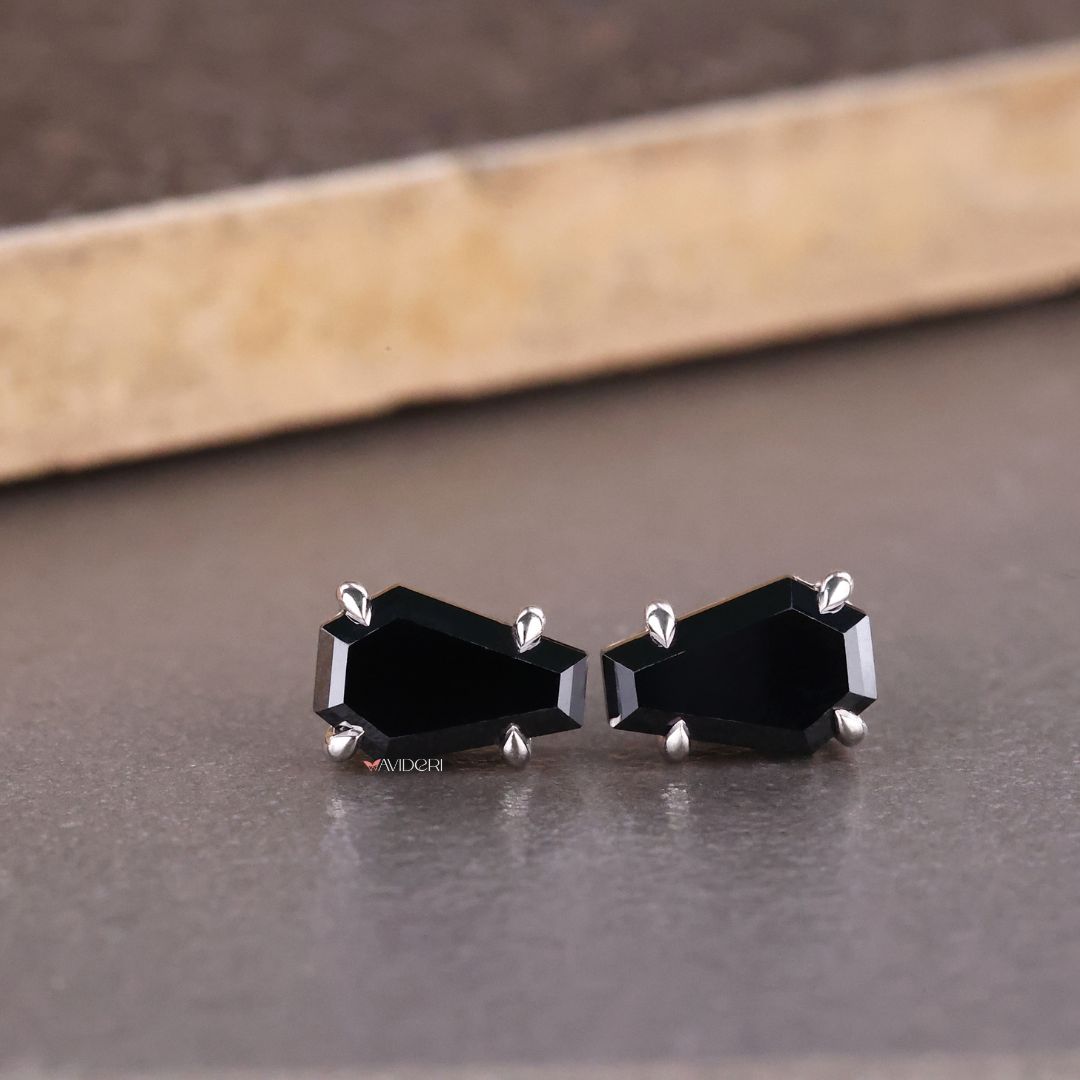 Moissanite stud earrings set in coffin earrings for added brilliance.
