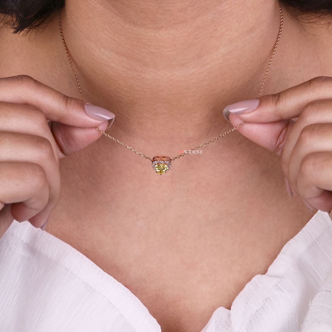 Stone heart pendant set in an elegant gold setting.