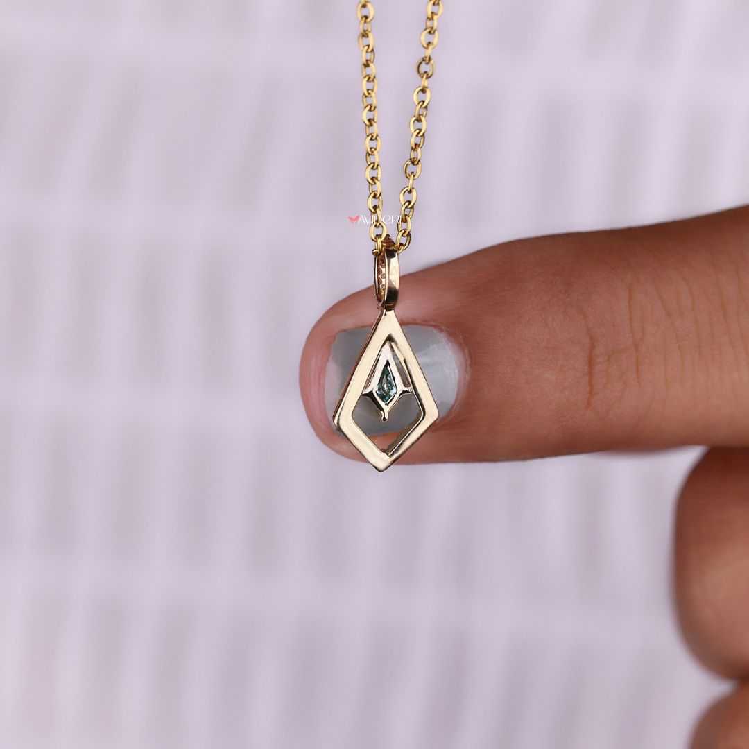 Round cut pendant with halo setting in yellow gold.