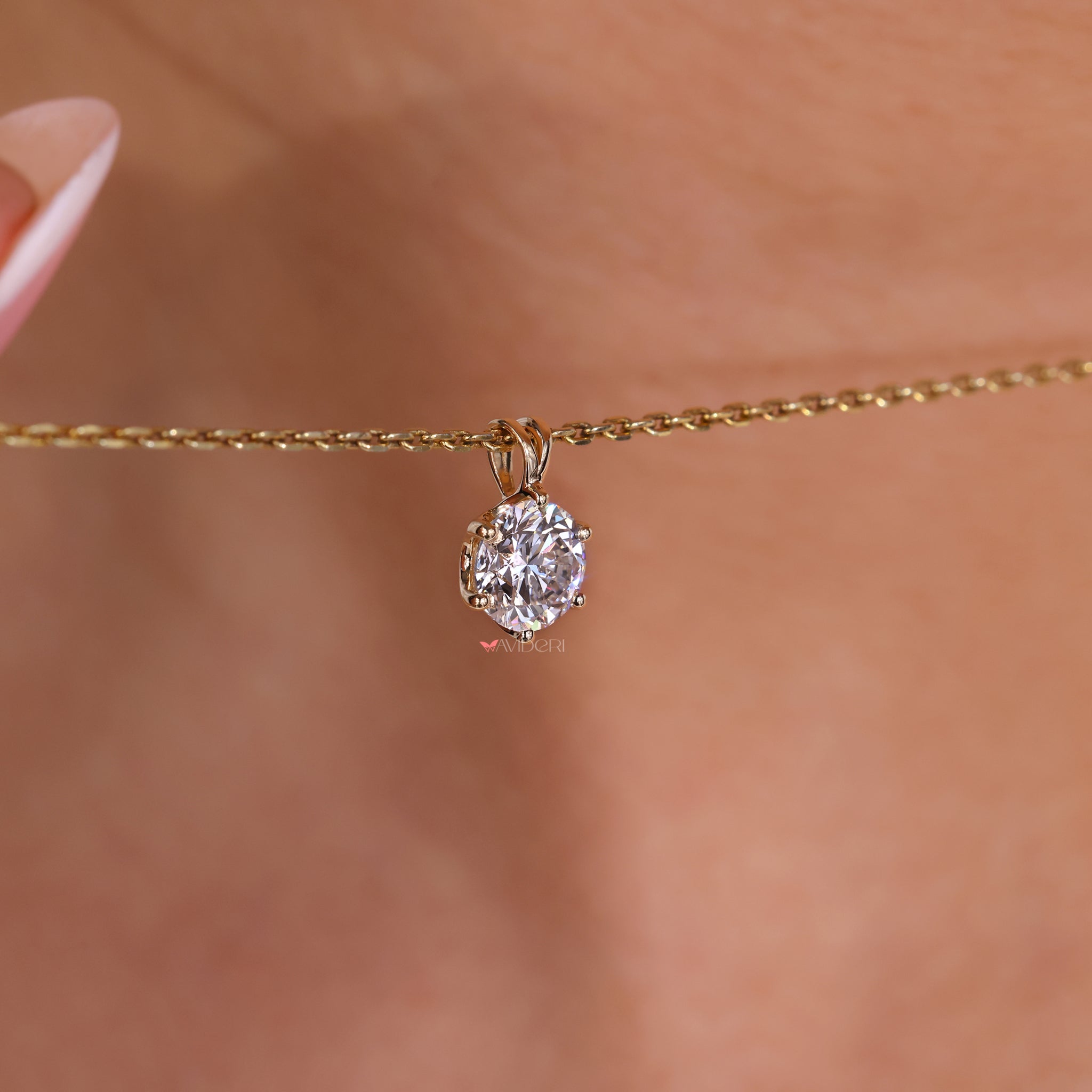 Solitaire diamond pendant in a classic setting.