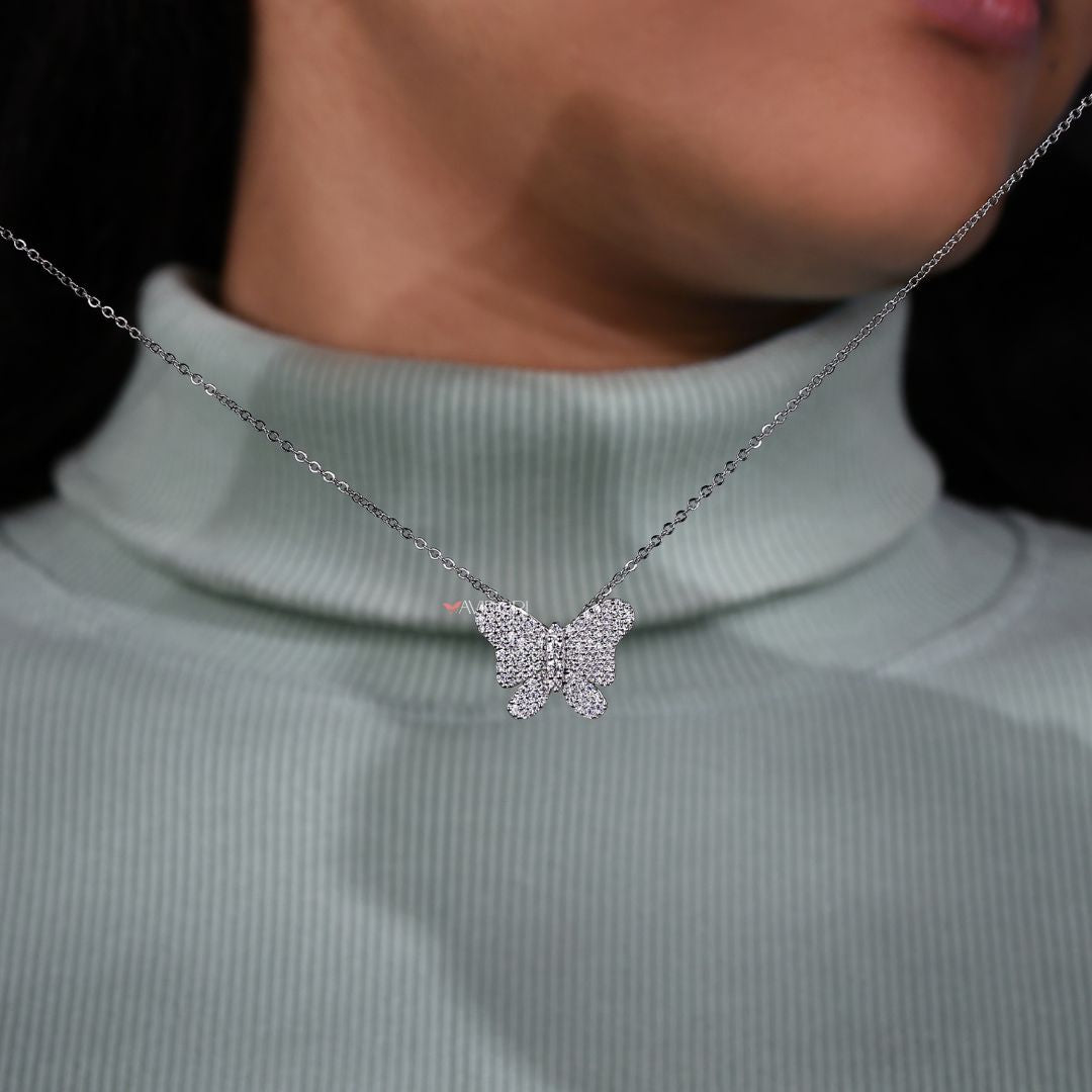 Butterfly pendant featuring a round cut lab diamond