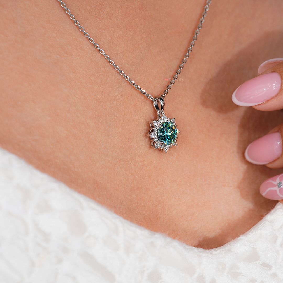 Cluster halo setting pendant in classic white gold.