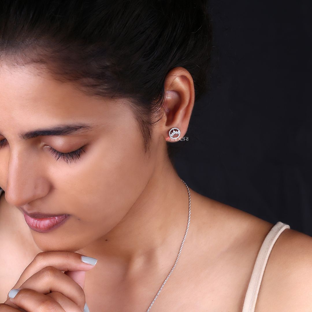 Unique Earrings featuring round cut Moissanite set in a beautiful white gold setting.