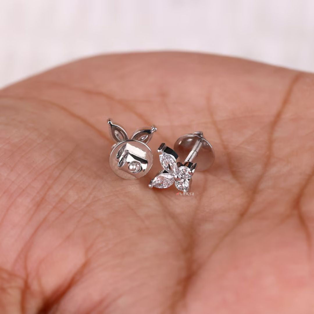 White gold earrings with prong settings and Marquise Moissanite for a secure fit.