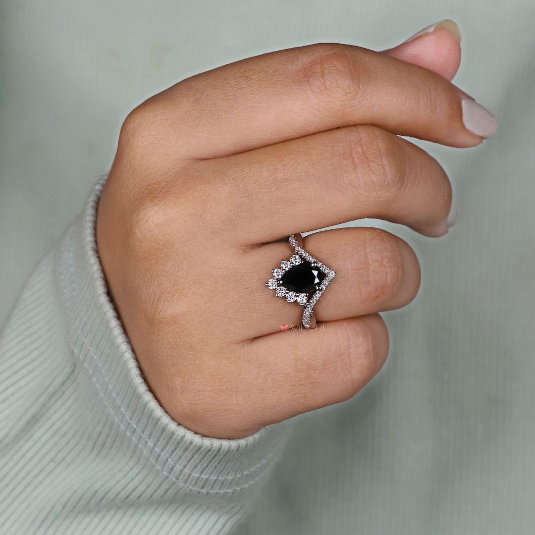 Tapered shank ring, designed to accentuate the center gemstone