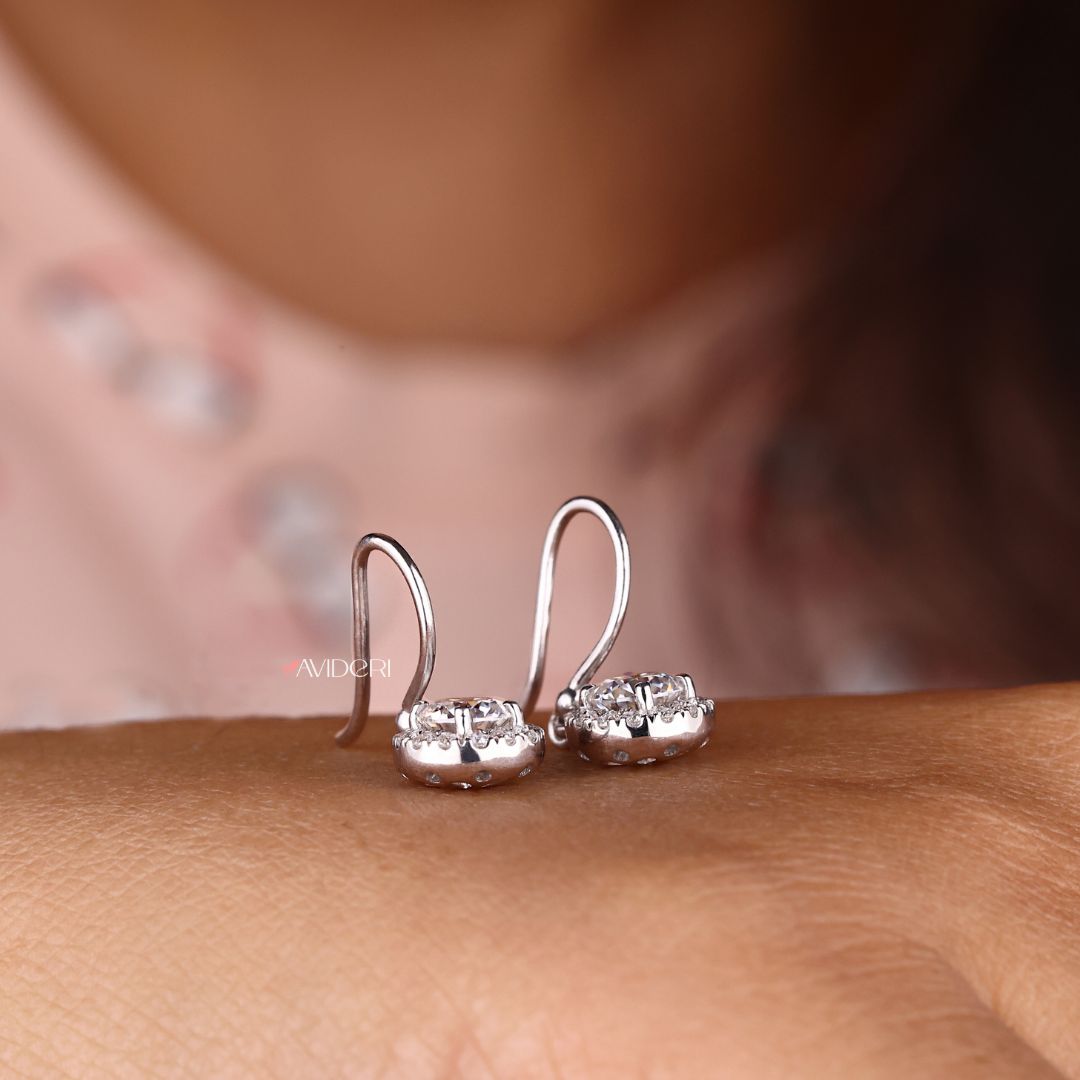 Moissanite halo earrings in wire hook style for a modern look.