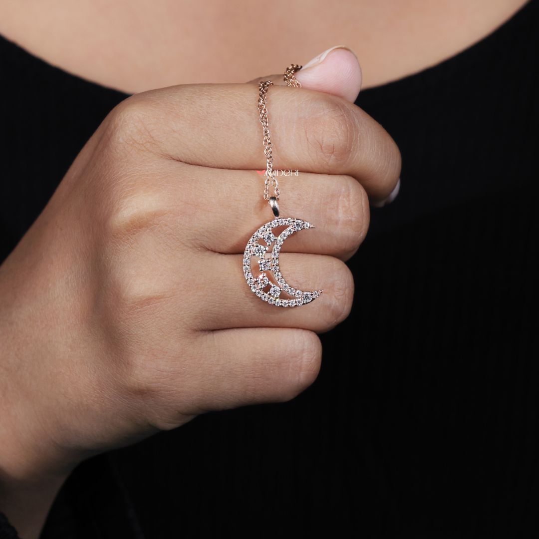 Round cut moissanite half moon delivers vibrant sparkle in a bold design.