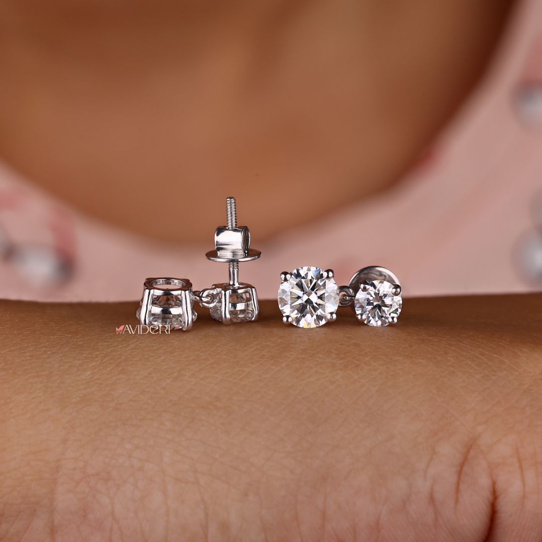 Moissanite stud earrings in round cut for timeless appeal.