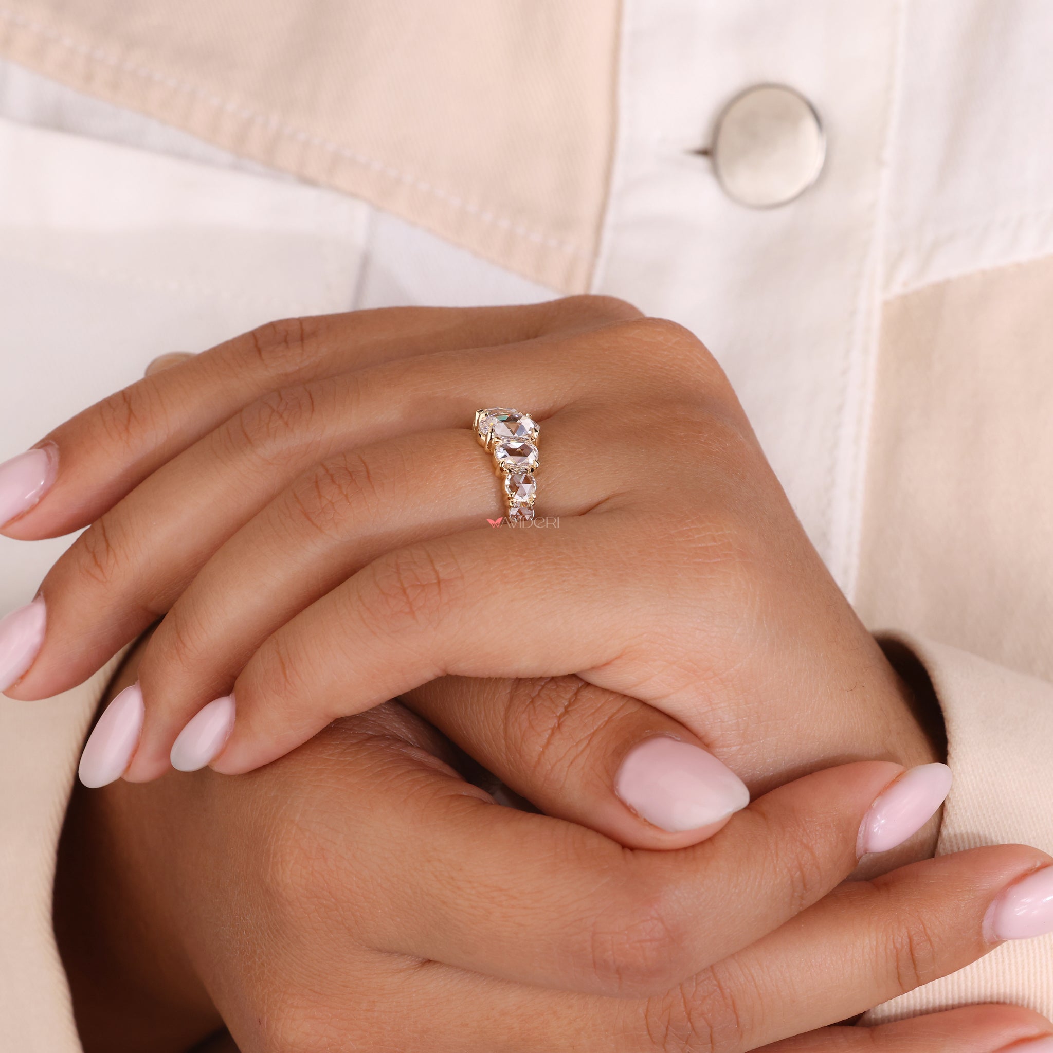 Half eternity wedding band featuring oval diamonds for extra sparkle.