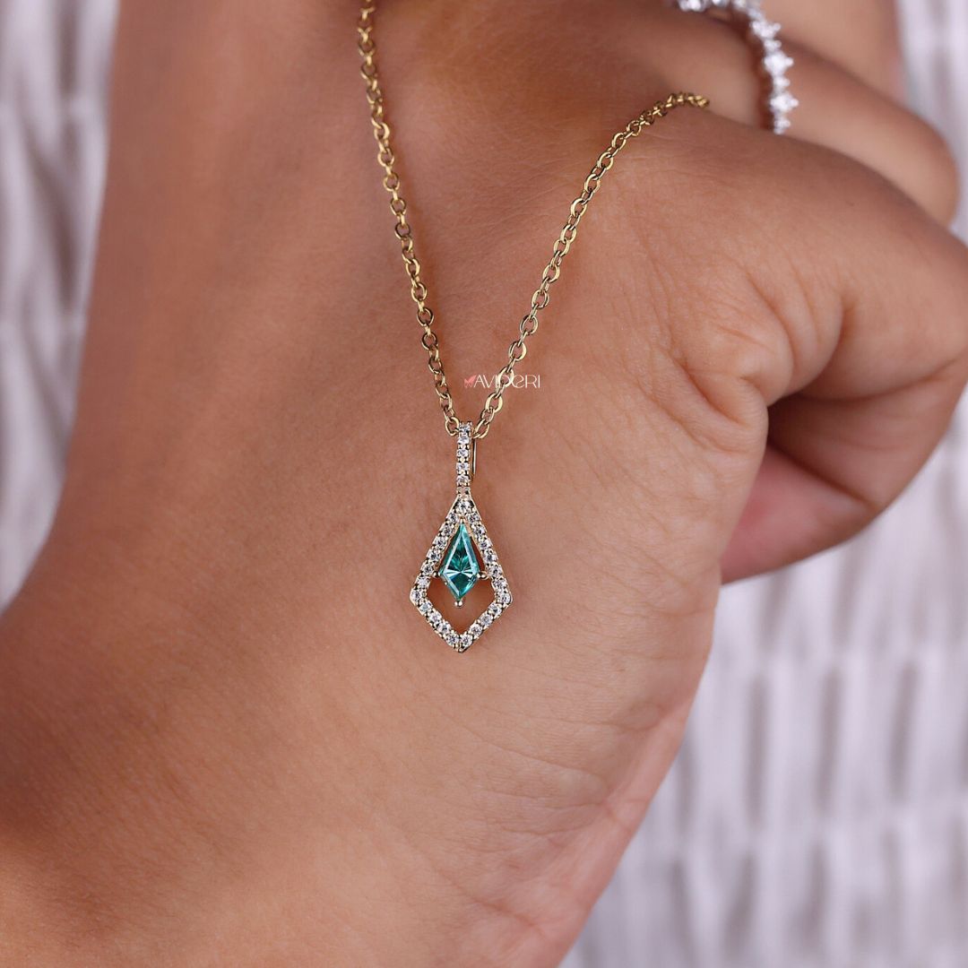 Halo pendant necklace in yellow gold with cyan blue stone.
