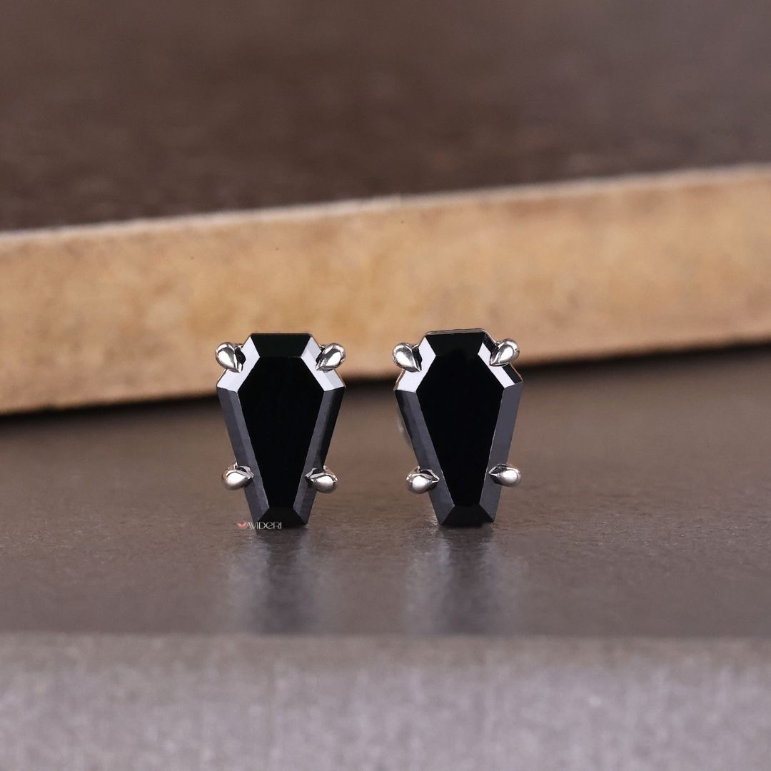 Bat coffin earrings in a sleek white gold earring setting for elegance.