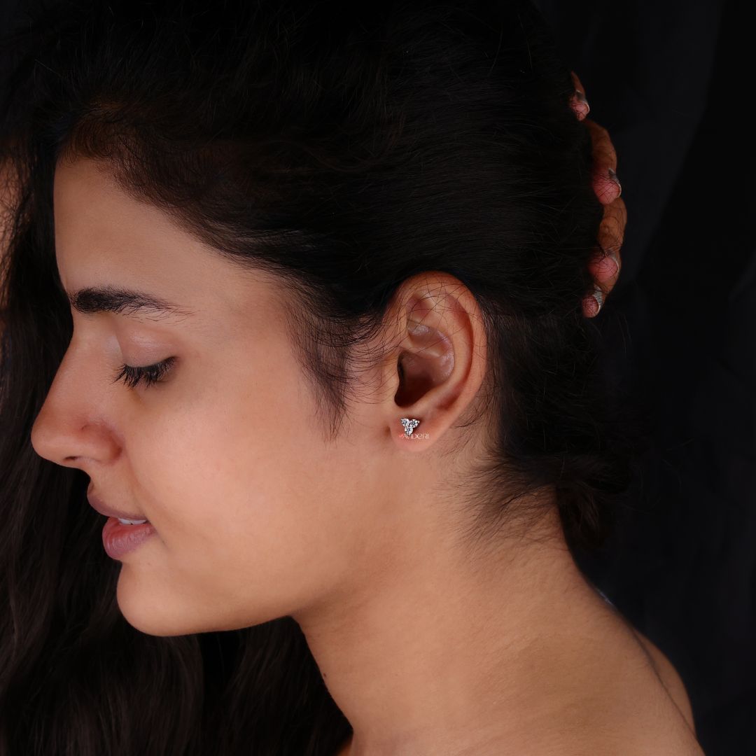 Everyday earrings with three stone round cut Moissanite for effortless style.