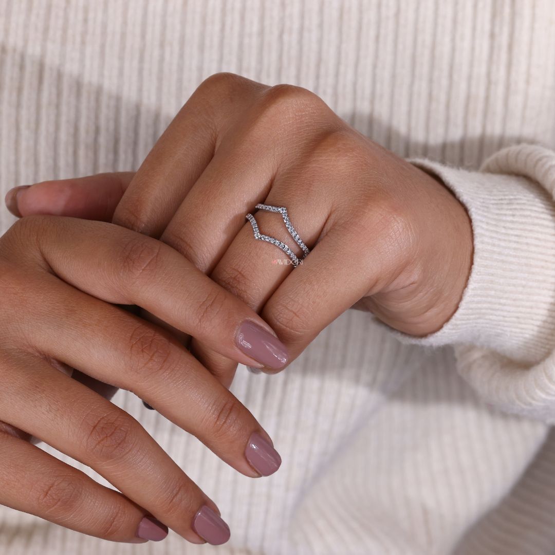 A moissanite gold wedding band combines sparkle with warmth.