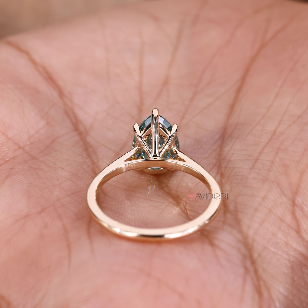 A pear cut moissanite ring brings charm with modern shine.