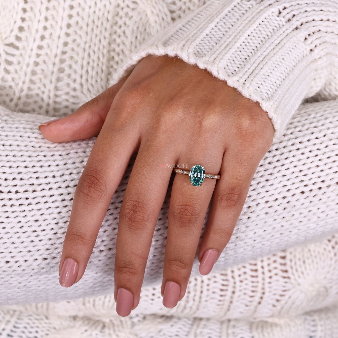 She wears a channel set engagement ring with elegance.